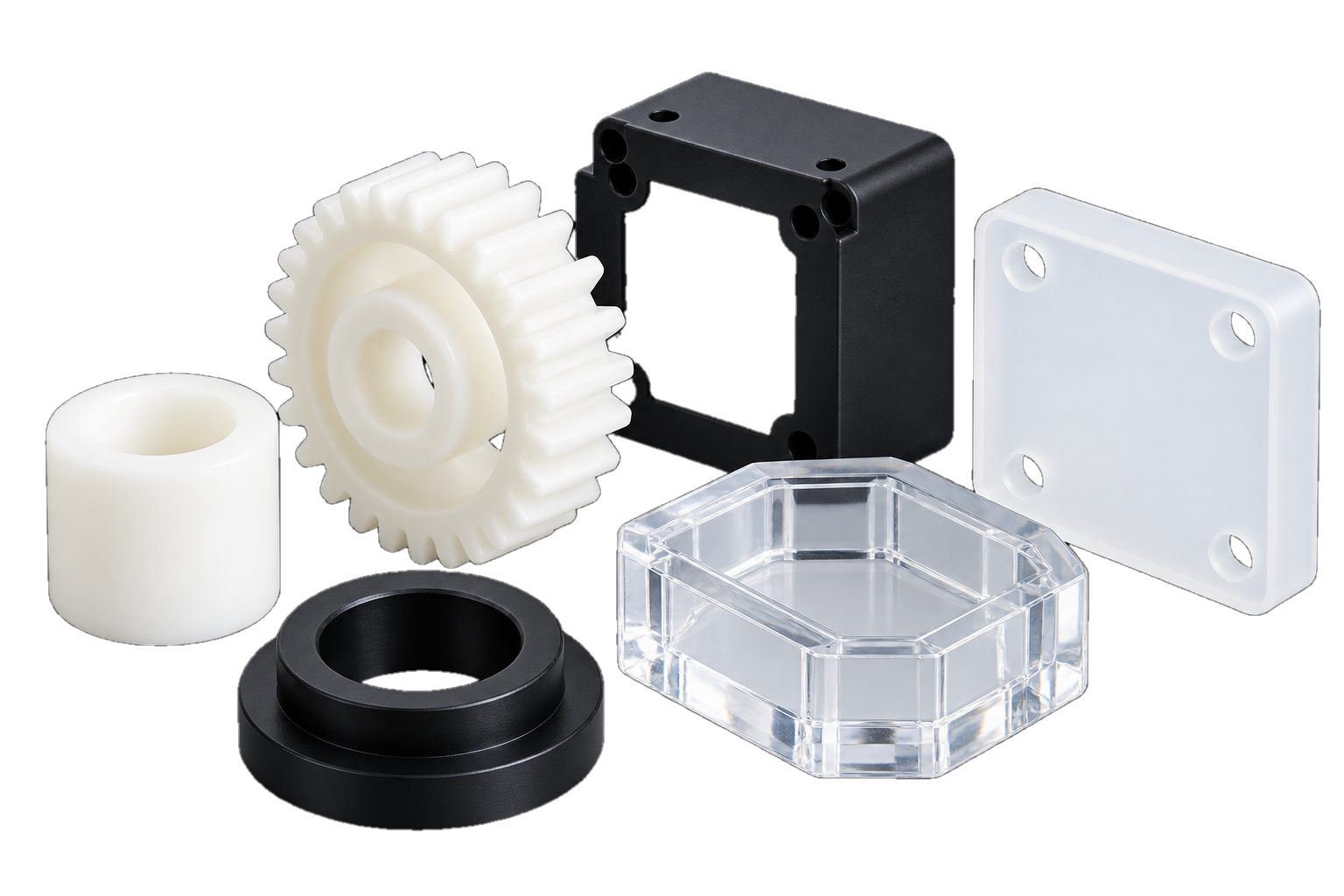Illustrative plastic components including a gear, bushings and clear plates
