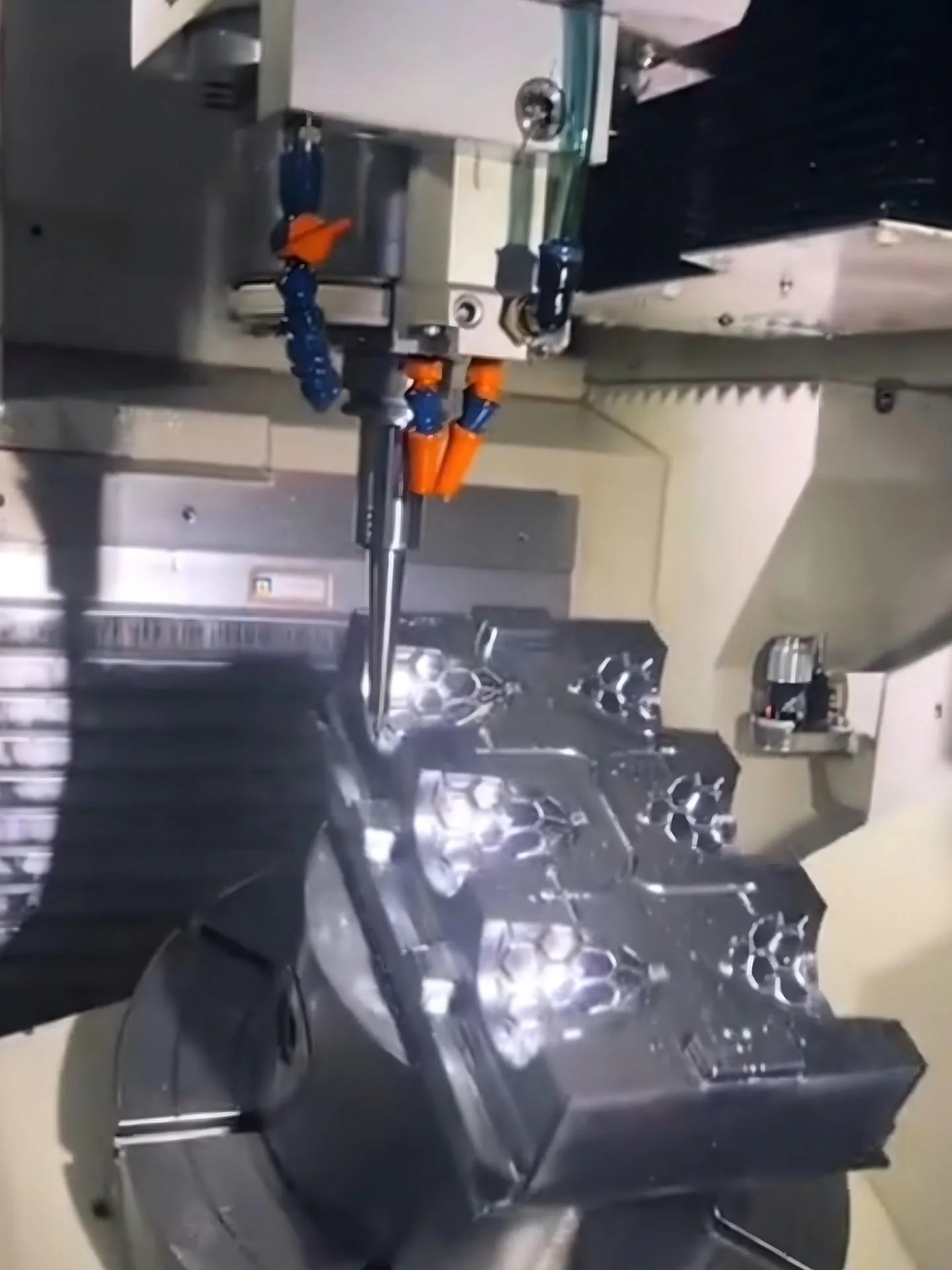 Cutting tool machining cavities in a metal mold block
