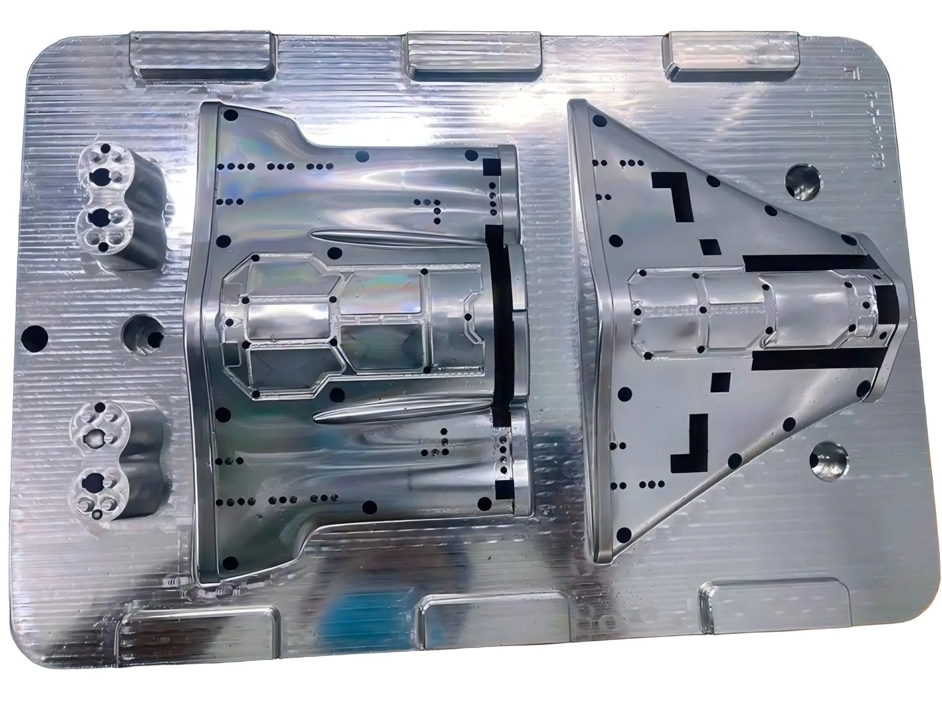 Machined mold plate with several differently shaped features